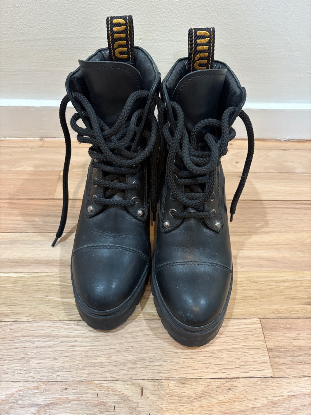 Miu Miu Black Lace-Up Leather Combat Boots with Yellow Logo Pull Tabs